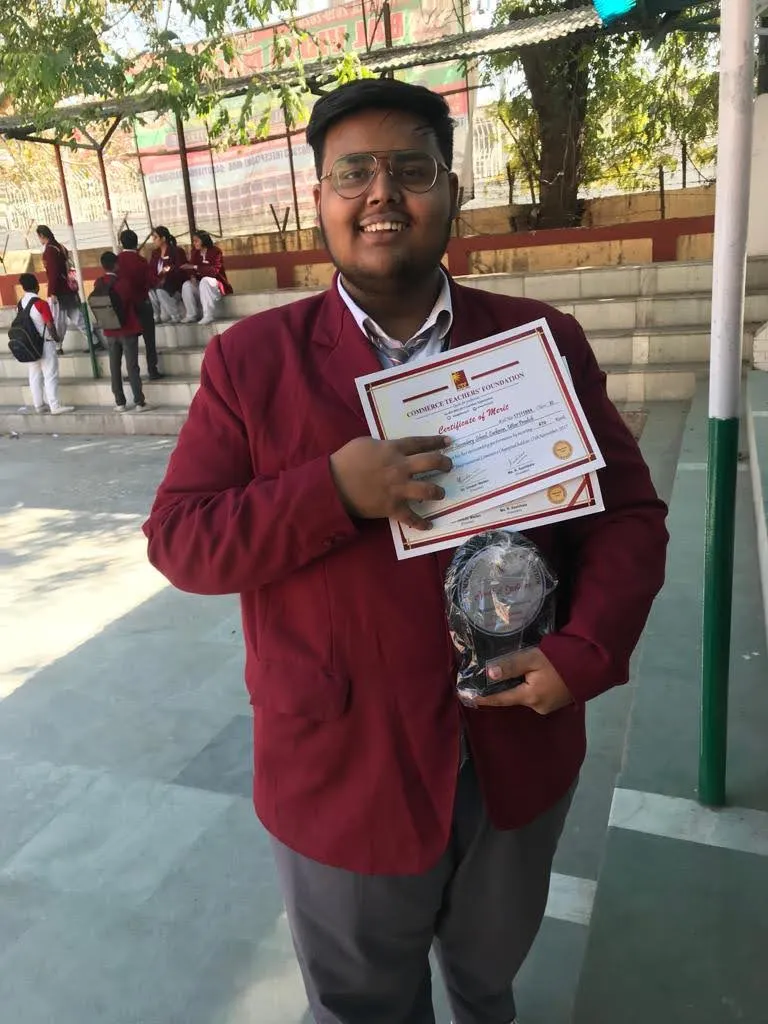 Me before my transformation with certificates and a trophy